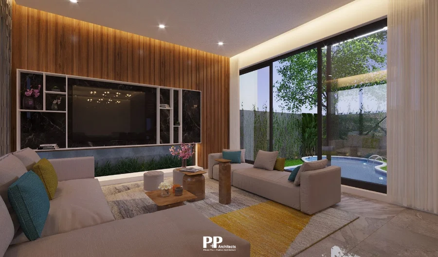 Không gian phòng khách villa xanh Nha Trang với cửa kính lớn và sân vườn bên ngoài