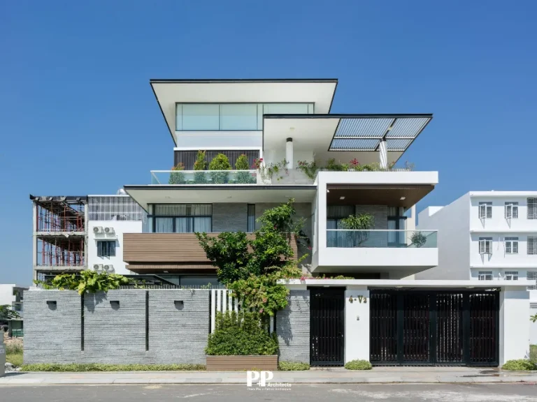 Thiết Kế Kiến Trúc Villa Xanh Nha Trang: Bền bỉ trước khi hậu đặc thù của địa phương 13 Thiết kế kiến trúc villa xanh Nha Trang với mặt tiền hiện đại, ban công xanh và lam che nắng