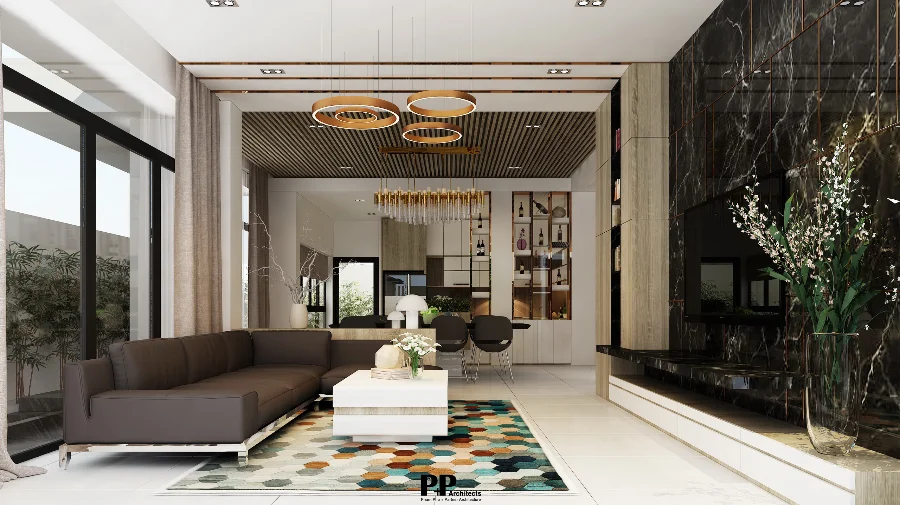 thiết kế villa xanh Nha Trang với phòng khách mở và cửa kính lớn